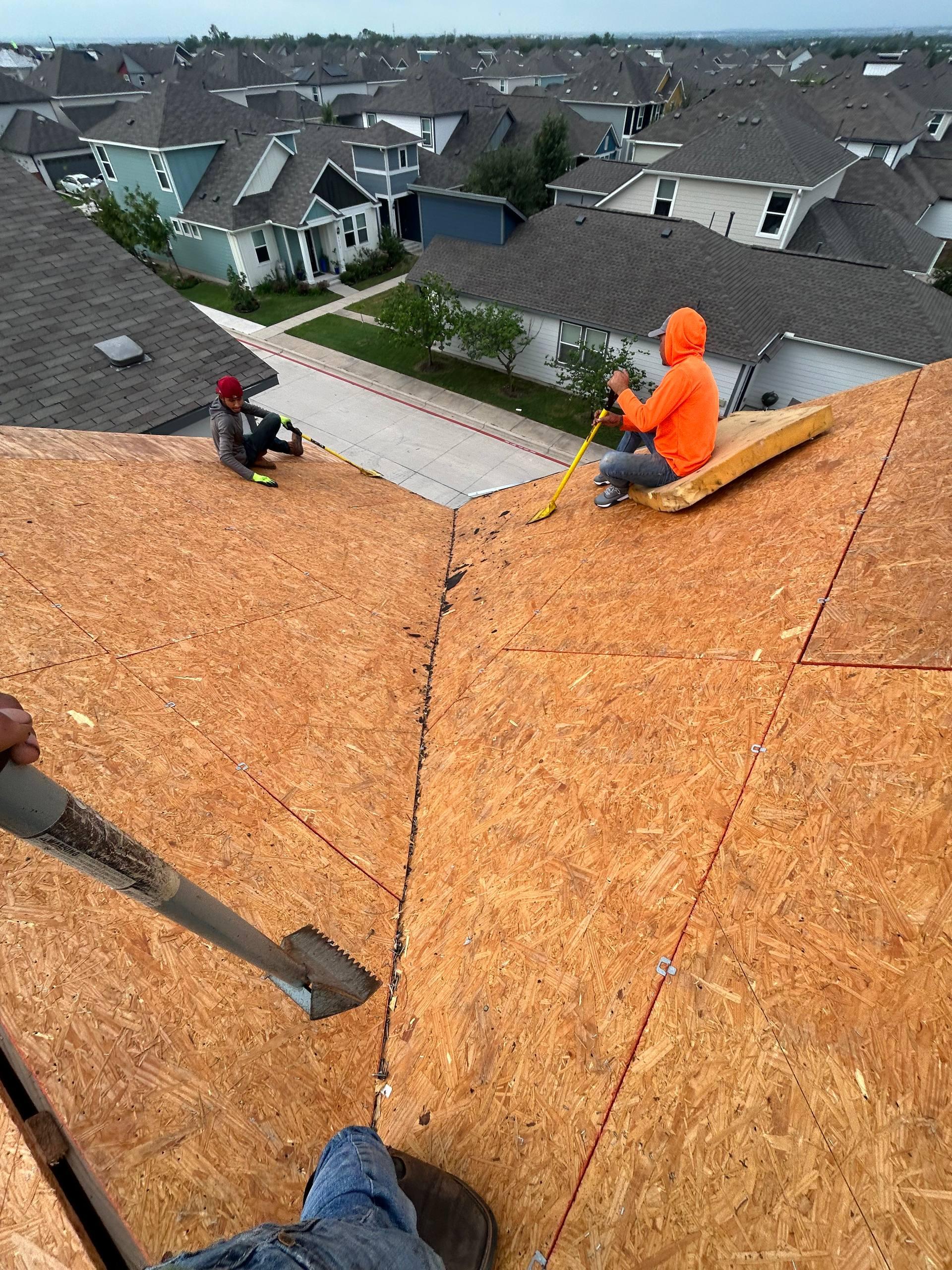 New School Roofing crew working on roof replacement